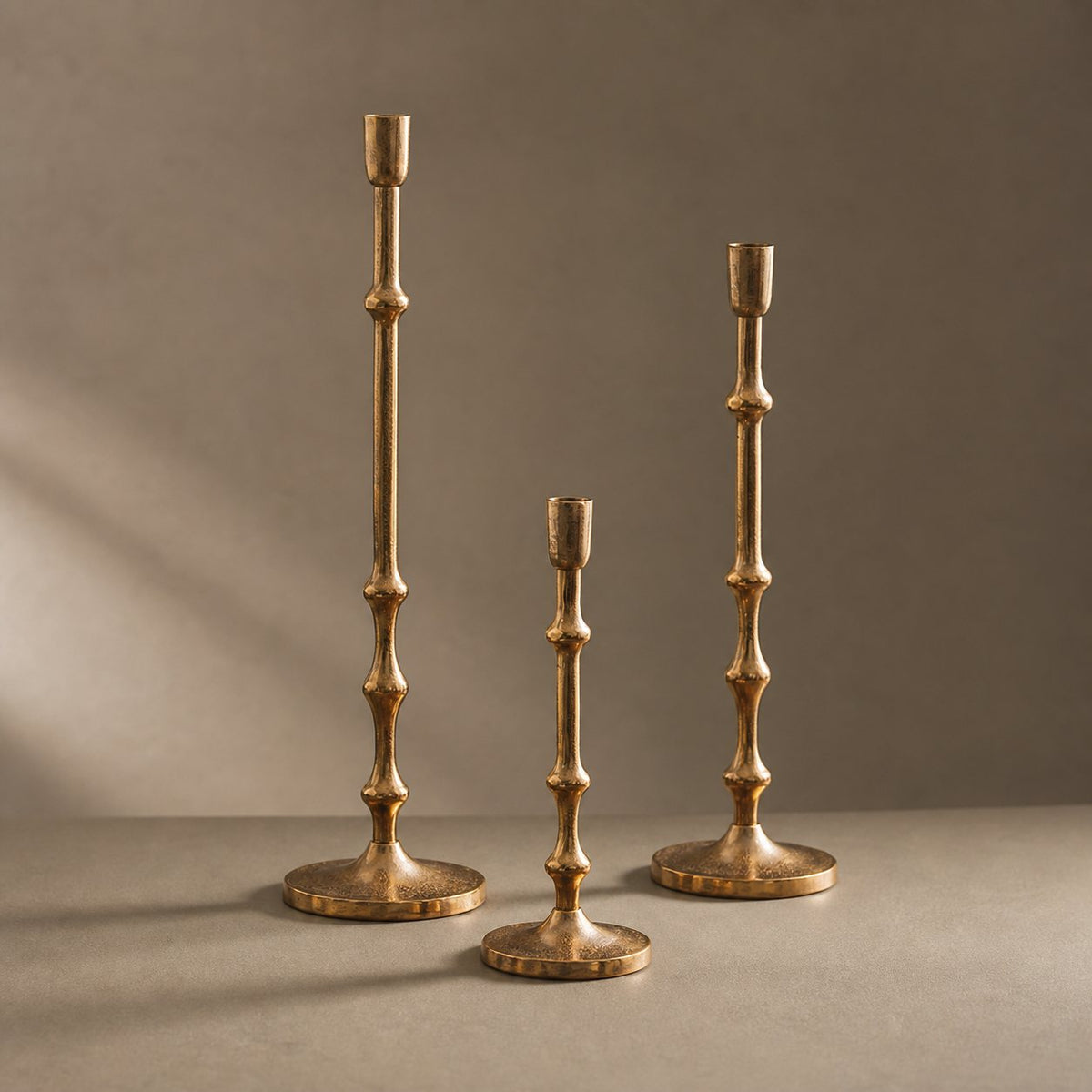 Hammered Brass-Tone Candlestick, all three sizes together, studio shot