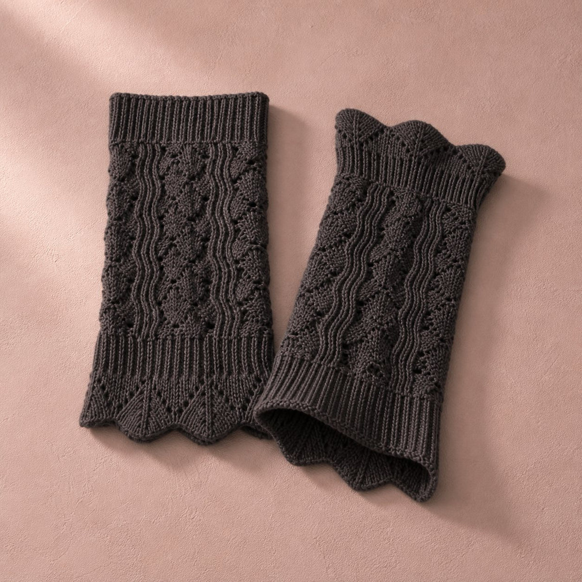 Charcoal pointelle knit boot cuffs, pair flat lay