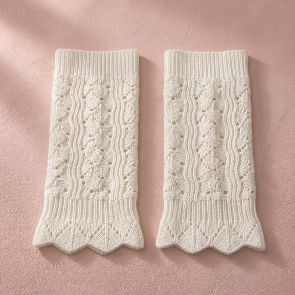 Ivory pointelle knit boot cuffs, pair flat lay