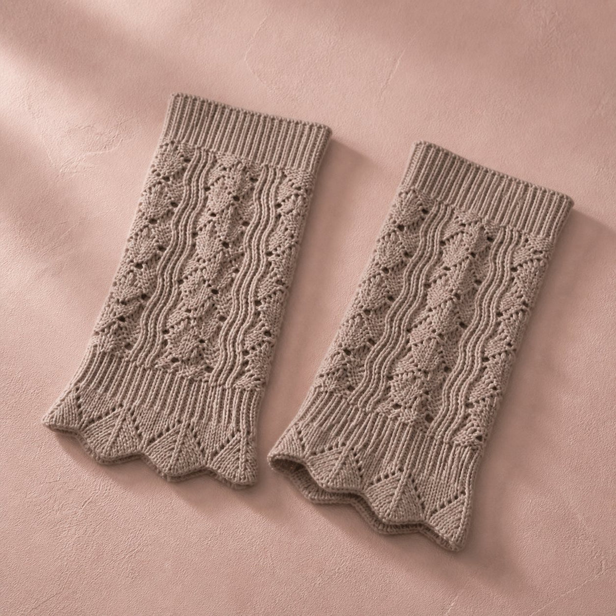 Taupe pointelle knit boot cuffs, pair flat lay