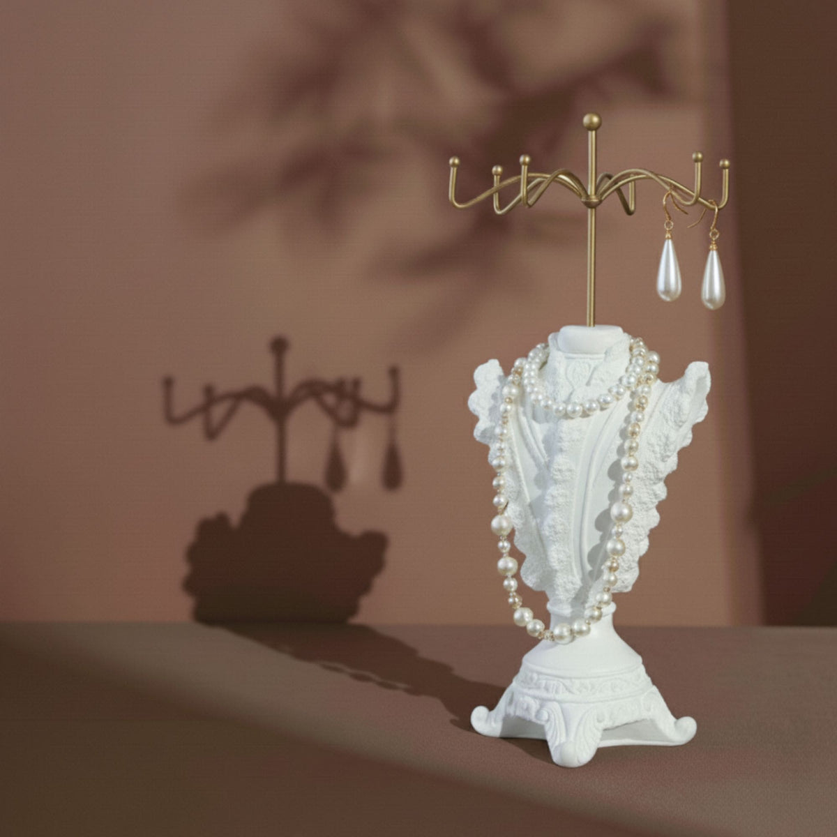 Ivory dress-form necklace stand with lace skirt and layered pearl necklaces