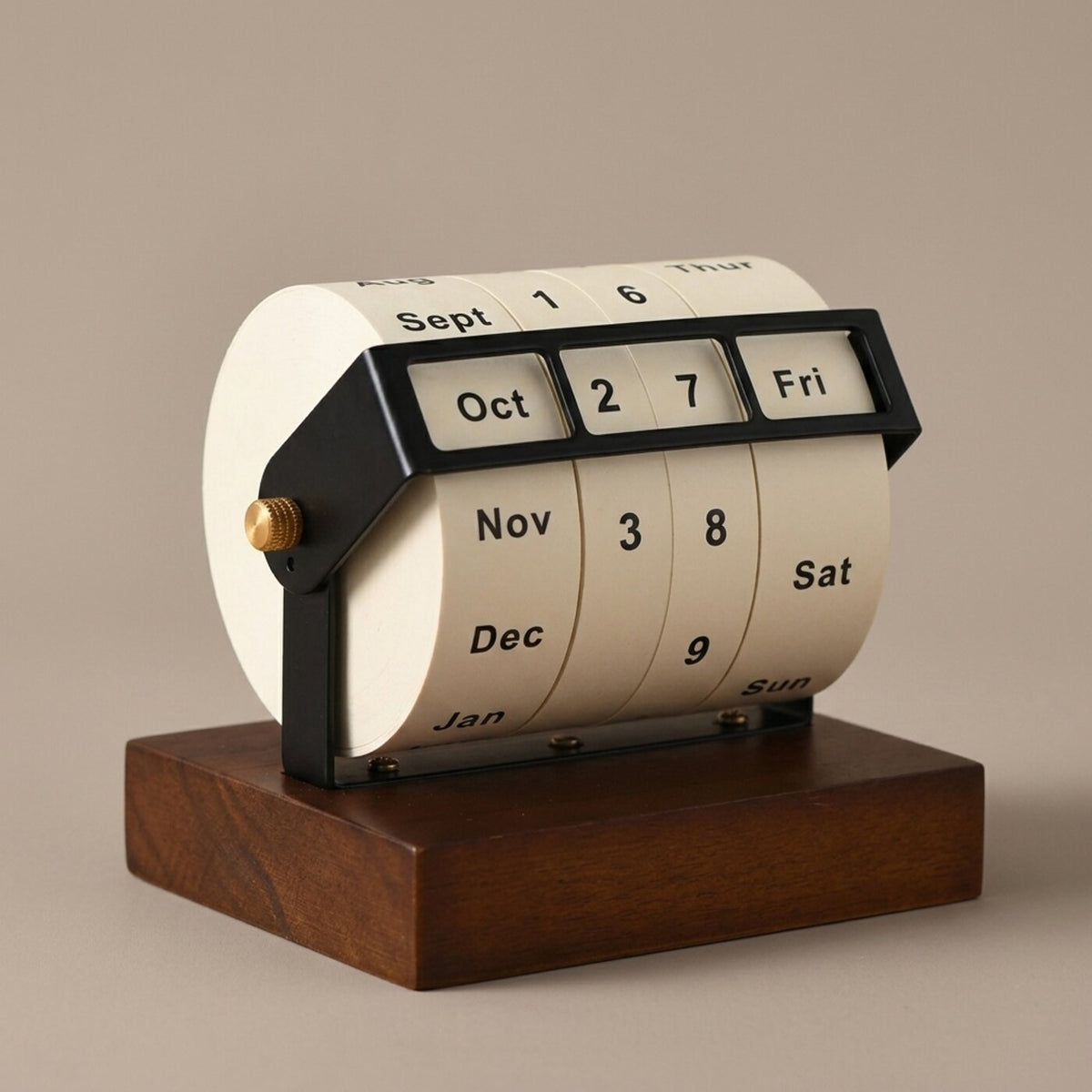 Wheel perpetual desk calendar on a neutral beige studio background, three-quarter view from the front-left